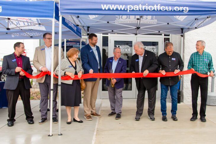 Patriot leadership cut ribbon.