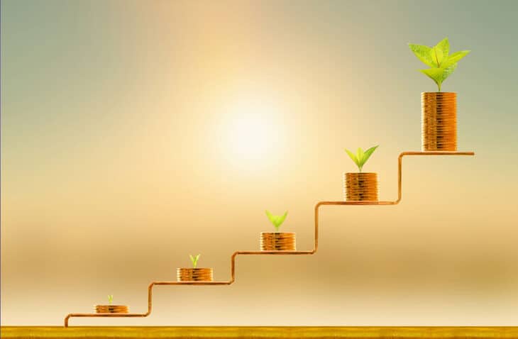 Growing stacks of coins with plants on top