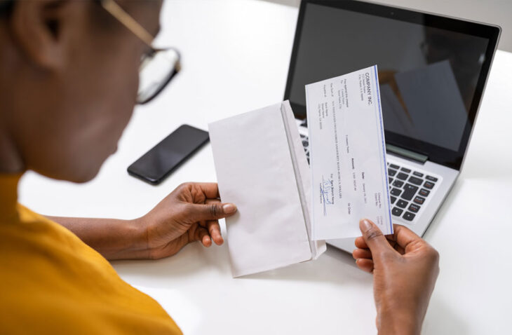 Woman looking at a check