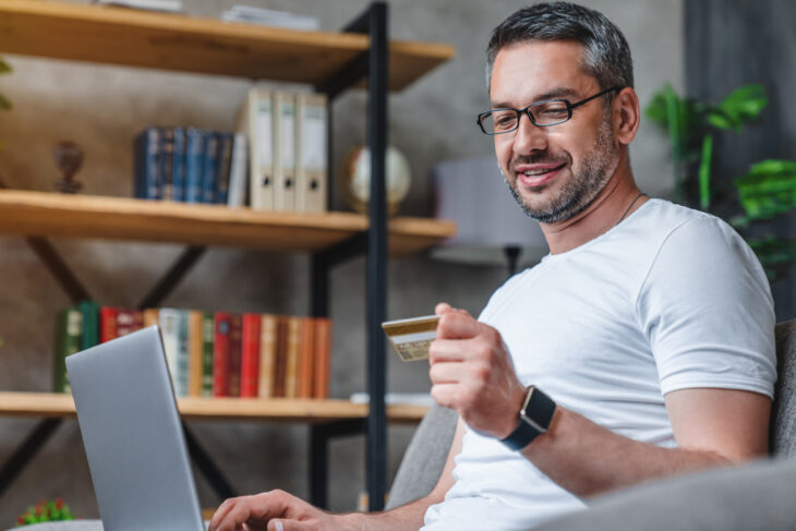 Man reading his card information