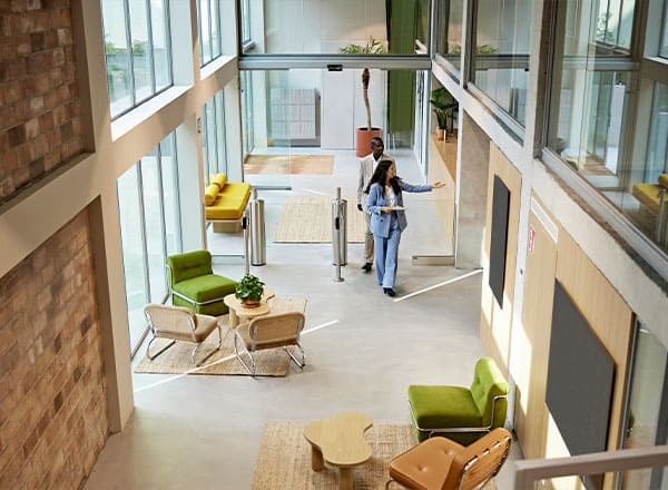 agent walking client through office building