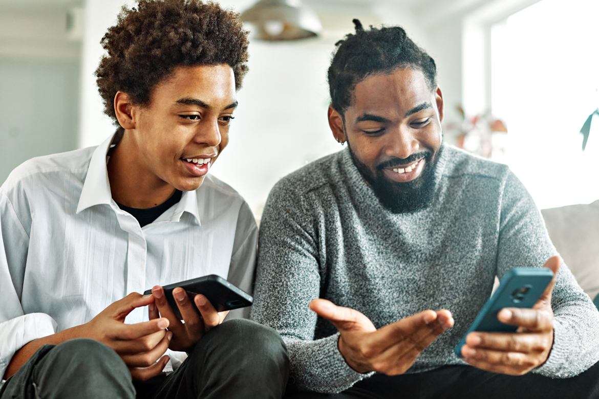 Son & Father Looking at Phone