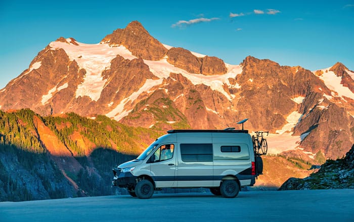 Recreational vehicle in front of mountains
