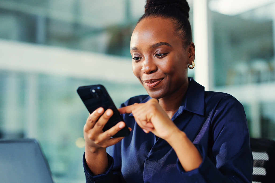 Woman looking at her phone pleasantly