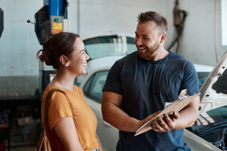 woman having her car fixed