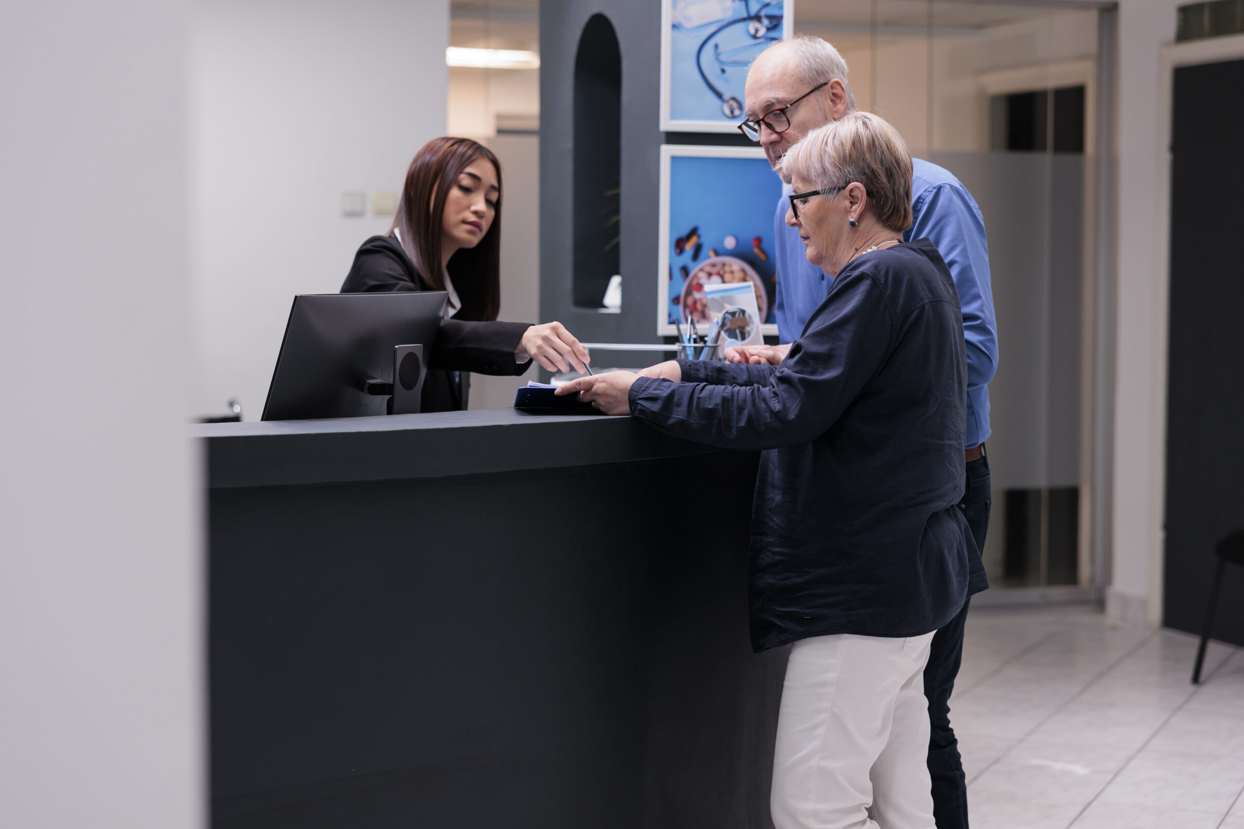 older couple chatting with teller